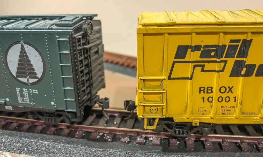 Closeup of model train boxcars