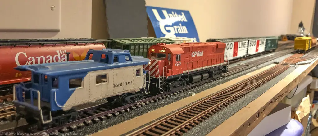 Model train caboose and locomotive